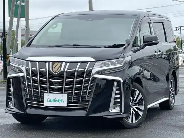 トヨタ アルファード SC 道央・札幌 2018(平30)年 1.6万km ブラック ４WD/JBLプレミアムサウンドシステム/純正ディーラーOPナビ/CD/DVD/BT/フルセグ/純正フリップダウンモニター/トヨタセーフティセンス/プリクラッシュセーフティ/横滑り防止装置/レーダークルーズコントロール/レーンキープアシスト/パーキングアシスト/クリアランスソナー/ブラインドスポットモニター/パーキングサポートブレーキ/バックカメラ/ビルトインETC2.0/ドライブレコーダー/アイドリングストップ/両側パワースライドドア/パワーバックドア/前席/２列目パワーシート/前席シートヒーター/前席エアシート/D席メモリーシート/N席/２列目オットマン/ステアリングリモコン/ハンドルヒーター/AC100V/自動防眩ミラー/電動パーキング/ブレーキホールド/MTモード付AT/プッシュスタート/スマートキー/純正リモートスタート/LEDヘッドライト/オートライト/オートハイビーム/フォグランプ/電動格納ミラー/ウィンカーミラー/純正フロアマット/ドアバイザー/スペアキー