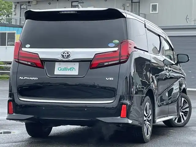 トヨタ アルファード SC 道央・札幌 2018(平30)年 1.6万km ブラック ４WD/JBLプレミアムサウンドシステム/純正ディーラーOPナビ/CD/DVD/BT/フルセグ/純正フリップダウンモニター/トヨタセーフティセンス/プリクラッシュセーフティ/横滑り防止装置/レーダークルーズコントロール/レーンキープアシスト/パーキングアシスト/クリアランスソナー/ブラインドスポットモニター/パーキングサポートブレーキ/バックカメラ/ビルトインETC2.0/ドライブレコーダー/アイドリングストップ/両側パワースライドドア/パワーバックドア/前席/２列目パワーシート/前席シートヒーター/前席エアシート/D席メモリーシート/N席/２列目オットマン/ステアリングリモコン/ハンドルヒーター/AC100V/自動防眩ミラー/電動パーキング/ブレーキホールド/MTモード付AT/プッシュスタート/スマートキー/純正リモートスタート/LEDヘッドライト/オートライト/オートハイビーム/フォグランプ/電動格納ミラー/ウィンカーミラー/純正フロアマット/ドアバイザー/スペアキー