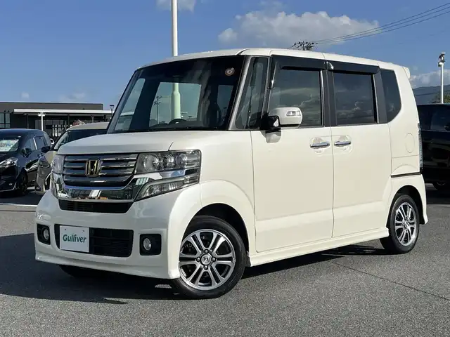 ホンダ Ｎ ＢＯＸ 2トーン カスタム SSパッケージ 奈良県 2015(平27)年 7万km プレミアムホワイトパール KENWOODナビ/（フルセグ/BT/CD/DVD）/バックカメラ/衝突軽減システム/両側パワースライドドア/横滑り防止/オートライト/電動格納ミラー/純正14インチAW/スペアキーX1