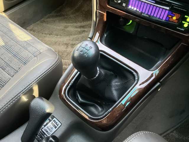 スバル レガシィ ランカスター 神奈川県 1999(平11)年 8万km ダークグリーンマイカ/ウォームグレーオパール ワンオーナー/ハーフレザーシート/MOMO革ウッドコンビステアリング/タワーバー/ウッド調パネル/純正オーディオ/キーレスキー/スペアキー/保証書/取扱説明書