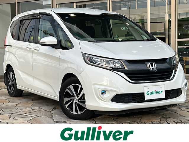 ホンダ フリード＋ G ホンダセンシング 静岡県 2018(平30)年 6.7万km ホワイトオーキッドパール 純正ナビ/・CD/・DVD/・Bluetooth/・SD/・FM/AM/・フルセグTV/ホンダセンシング/●衝突軽減ブレーキ〈CMBS〉/●誤発進抑制機能/●ACC〈アダプティブ・クルーズ・コントロール〉/●LKAS〈車線維持支援システム〉/●歩行者事故低減ステアリング/●路外逸脱抑制機能/●先行車発進お知らせ機能/●標識認識機能/主要装備/・バックカメラ/・両側パワースライドドア/・ドライブレコーダー/・ハーフレザーシート/(Sパッケージ専用インテリア)/・アイドリングストップ/・ＥＴＣ/・ＬＥＤヘッドライト/・アクティブコーナリングライト/・本革巻ステアリング/・純正15インチアルミ