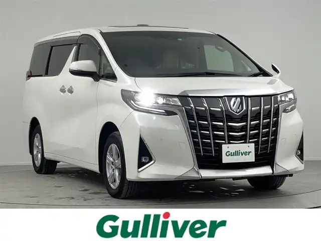 トヨタ アルファードハイブリット X 熊本県 2022(令4)年 3.9万km ホワイトパールクリスタルシャイン 純正ナビ　/フリップダウンモニター　/ツインサンルーフ　/両側パワースライドドア　/衝突被害軽減装置　/クルーズコントロール　/ブラインドスポットモニター/レーンキープアシスト　/オットマン　/オートマチックハイビーム　/フルセグテレビ　/ＥＴＣ2.0