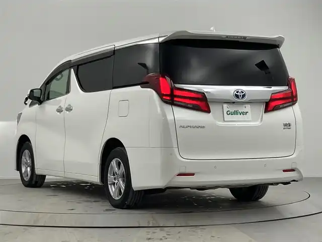 トヨタ アルファードハイブリット X 熊本県 2022(令4)年 3.9万km ホワイトパールクリスタルシャイン 純正ナビ　/フリップダウンモニター　/ツインサンルーフ　/両側パワースライドドア　/衝突被害軽減装置　/クルーズコントロール　/ブラインドスポットモニター/レーンキープアシスト　/オットマン　/オートマチックハイビーム　/フルセグテレビ　/ＥＴＣ2.0