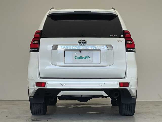 トヨタ ランドクルーザー プラド TX 愛知県 2021(令3)年 2.2万km ホワイトパールクリスタルシャイン モデリスタエアロ/10型ナビ（フルセグTV）/Bluetooth/バックモニター/バックカメラ/ビルトインETC/ルーフレール/トヨタセーフティセンス/レーダークルーズコントロール/クリアランスソナー/LEDヘッドライト/オートライト/オートハイビーム/純正17インチAW/ドアバイザー/フロアマット/シートカバー/プッシュスタート/スマートキー