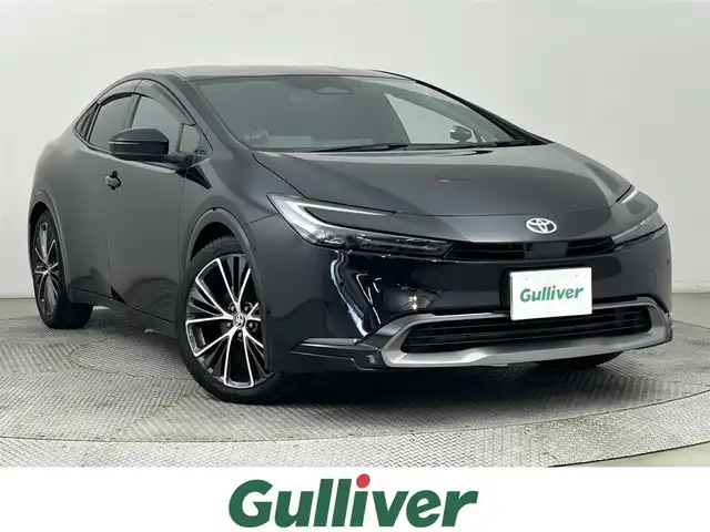 トヨタ プリウス Z 道央・札幌 2023(令5)年 0.3万km アティチュードブラックマイカ ・４WD/・寒冷地仕様/・純正コネクティッドナビ/　USB/フルセグ/BT/Miracast/・ビルトインETC2.0/・デジタルインナーミラー/・パノラミックビューモニター/・パワーバックドア/・トヨタセーフティセンス/・レーンキープアシスト/・プリクラッシュセーフティ/・オートブレーキホールド/・レーンディパーチャーアラート/・ブラインドスポットモニター/・プロアクティブドライビングアシスト/・リアクロストラフィックアラート/・パーキングサポートブレーキ/・ロードサインアシスト/・レーダークルーズコントロール/・横滑り防止装置/・前席シートヒーター・シートベンチレーション/・運転席パワーシート（メモリ付）/・前後コーナーセンサー/・100V1500W充電/・ステアリングヒーター/・LEDヘッドライト/・アダプティブハイビーム/・オートライト/・フロントフォグライト/・スマートキー/・プッシュスタート/・保証書付き/・純正AW19インチ