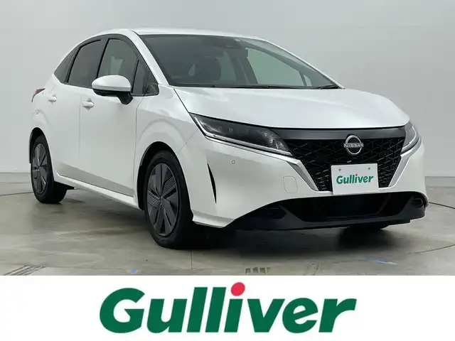 日産 ノート X 岡山県 2023(令5)年 1.7万km ピュアホワイトパール 純正9インチナビ/・FM/AM/Bluetooth/フルセグ/CarPlay/HDMI/インテリジェントアラウンドビューモニター/インテリジェントルームミラー/ワイヤレス充電/三眼LEDヘッドライト/ETC2.0/ドライブレコーダー/インテリジェントエマージェンシーブレーキ/踏み間違い防止/車線逸脱警報/防止支援システム/BSM/コーナーセンサー/オートブレーキホールド/USB入力端子/純正フロアマット