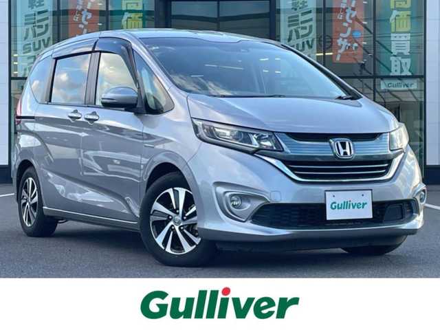 ホンダ フリード ハイブリット G ホンダセンシング 岡山県 2017(平29)年 6万km ルナシルバーM 登録時走行距離：60007km/禁煙車/純正ナビ/　(CD/DVD/フルセグTV/Bluetooth)/バックカメラ/クルーズコントロール(追従走行あり)/衝突被害軽減システム/車線逸脱警報（レーンキープアシスト）/ETC/両側パワースライドドア/ハーフレザーシート/ステアリングヒーター/革巻きステアリング/ステアリングスイッチ/純正LEDヘッドライト/フォグライト/オートライト/プッシュスタート/スマートキー/アイドリングストップ/純正アルミホイール 15インチ/ドアバイザー/電動格納ミラー/純正フロアマット/横滑防止装置/盗難防止装置