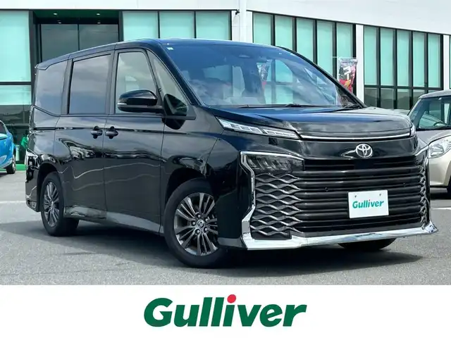 トヨタ ヴォクシー S－G 奈良県 2024(令6)年 1.1万km アティチュードブラックマイカ 純正8インチディスプレイオーディオ/（AM/FM/BT/USB)/バックカメラ/両側パワースライドドア/トヨタセーフティセンス/ETC2.0/ドライブレコーダー/純正LEDヘッドライト/純正フロアマット/電格ウインカーミラー/プッシュスタート