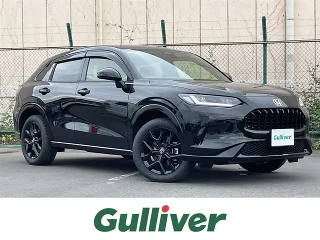 ホンダ ＺＲ－Ｖ ハイブリッド e:HEV Z ブラックスタイル 東京都 2024(令6)年 2.5万km クリスタルブラックパール ４ＷＤ　/純正９型ナビ　/電動リアゲート　/追従クルコン　/ビルトイン２．０ＥＴＣ　/前後ドラレコ　/フルセグＴＶ　/置型充電　/パドルシフト　/パワーシート　/シートメモリー　/シートヒーター　/ＢＳＭ　/コーナーセンサー