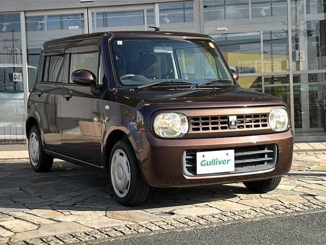 スズキ ラパン 静岡県 2013(平25)年 9万km マルーンブラウンパール ・社外ナビ（AVN112M）/・ワンセグTV（AM.FM.CD.USB）/・プッシュスタート/・ドアバイザー/・純正ホイールキャップ/・パワーウィンドウ/・社外フロアマット