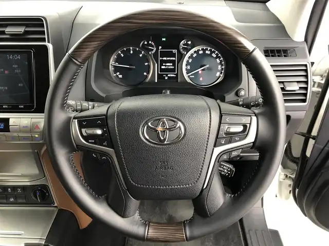 トヨタ ランドクルーザー プラド TX-L 70thアニバーサリーLTD 愛知県 2022(令4)年 4.1万km ホワイトパールクリスタルシャイン サンルーフ/茶革シート　　/純正9インチSDナビ　/(フルセグＴＶ/DVD/CD/SD)/バックカメラ　/ジャオスリフトアップ　/純正サスペンション積込　/社外グリル装着　/70th専用フロアマット/シートヒーターD＋N席/エアシートD＋N席/パワーシートD＋N席/ターボ/ETC/トヨタセーフティセンス/・LDA/・クリアランスソナー/・PCS/・RSA/・先行車発進告知/アダクティブクルーズコントロール/2ndSTART/ドアバイザー