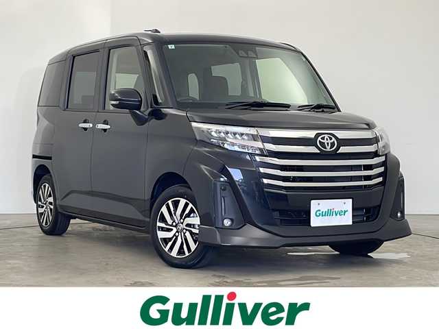 トヨタ ルーミー カスタムG 秋田県 2024(令6)年 0.6万km ブラックマイカメタリック ４WD/社外ナビ【AM/FM/BT】 /バックカメラ　/両側パワースライドドア /ETC /クルーズコントロール　/アイドリングストップ　/スマートキー　/プッシュスタート/LEDヘッドライト　/フォグライト /スマートアシスト/衝突被害軽減システム/横滑り防止装置/レーンキープアシスト/自動パーキングブレーキ/オートホールド/PWR　/オートライト/オートエアコン /純正AW/ウィンカーミラー /リアサンシェード /電格ミラー/社外フロアマット/革巻きステアリング