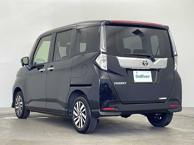 トヨタ ルーミー カスタムG 秋田県 2024(令6)年 0.6万km ブラックマイカメタリック ４WD/社外ナビ【AM/FM/BT】 /バックカメラ　/両側パワースライドドア /ETC /クルーズコントロール　/アイドリングストップ　/スマートキー　/プッシュスタート/LEDヘッドライト　/フォグライト /スマートアシスト/衝突被害軽減システム/横滑り防止装置/レーンキープアシスト/自動パーキングブレーキ/オートホールド/PWR　/オートライト/オートエアコン /純正AW/ウィンカーミラー /リアサンシェード /電格ミラー/社外フロアマット/革巻きステアリング