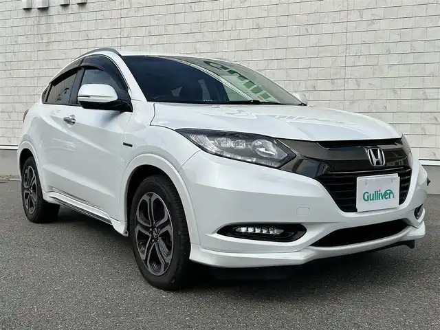 ホンダ ヴェゼル ハイブリッド Z ホンダセンシング 山形県 2016(平28)年 4万km ホワイトオーキッドパール ４WD/純正8インチナビ/フルセグTV/FM/AM/DVD/Bluetooth/衝突軽減ブレーキ/車線逸脱警報/横ブレ防止装置/バックカメラ/クルーズコントロール/プッシュスタート/ドライブレコーダー/純正マット/純正バイザー/ダブルエアバック/LEDライト/ＡＵＴＯライト/フォグランプ/保証書/取扱説明書