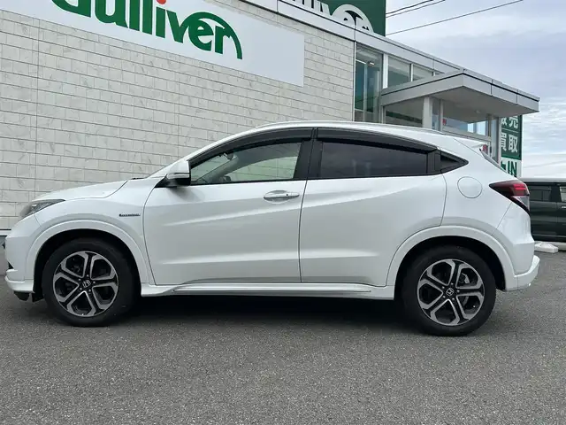 ホンダ ヴェゼル ハイブリッド Z ホンダセンシング 山形県 2016(平28)年 4万km ホワイトオーキッドパール ４WD/純正8インチナビ/フルセグTV/FM/AM/DVD/Bluetooth/衝突軽減ブレーキ/車線逸脱警報/横ブレ防止装置/バックカメラ/クルーズコントロール/プッシュスタート/ドライブレコーダー/純正マット/純正バイザー/ダブルエアバック/LEDライト/ＡＵＴＯライト/フォグランプ/保証書/取扱説明書