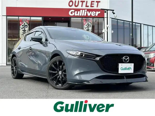 マツダ マツダ３ファストバック 15S ツーリング 静岡県 2019(令1)年 7.4万km ポリメタルグレーM 登録時走行距離73747km/純正メモリナビ【CD/DVD/Bluetooth】/フルセグTV/レーダークルーズコントロール/バックカメラ/コーナーセンサー/プッシュスタート/LEDライト/ETC/社外ホイール/ドアバイザー/ステアリングスイッチ/ウィンカーミラー/フォグランプ/禁煙車/レザー調シートカバー(取り外し可能/黒色布シートです)