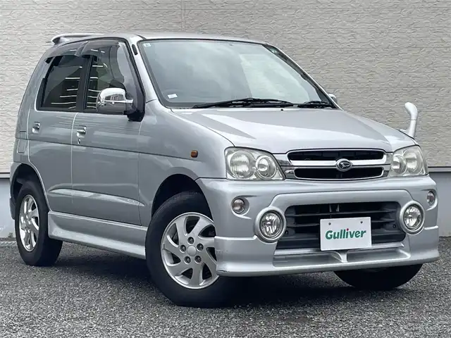ダイハツ テリオス キッド カスタム メモリアルED 大阪府 2001(平13)年 6.2万km シルバーメタリック キーレス/電動格納ミラー/ナビ（NSCP-W62)/GPSアンテナ、TVアンテナなし/CD/SD/Bluetooth対応/純正フロアマット/ドアバイザー/フロントフォグライト/純正エアロ（F/S/R/Rスポイラー）/背面タイヤ/純正15インチAW/メッキドアミラー/メッキドアノブ/取扱説明書/保証書
