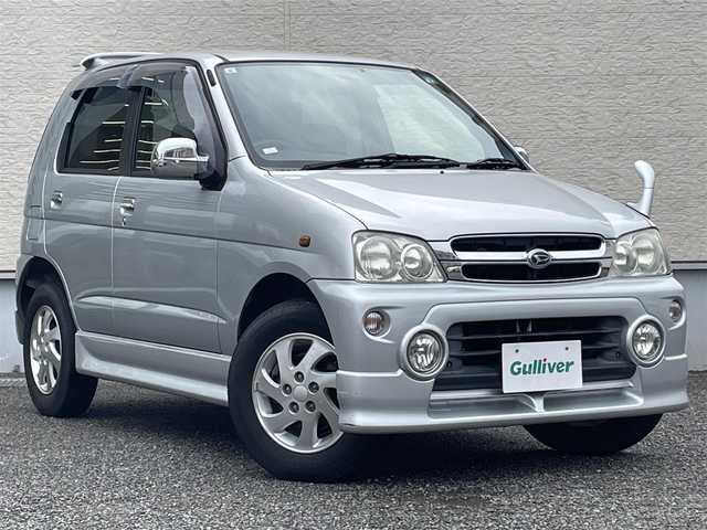 ダイハツ テリオス キッド カスタム メモリアルED 大阪府 2001(平13)年 6.2万km シルバーメタリック キーレス/電動格納ミラー/ナビ（NSCP-W62)/GPSアンテナ、TVアンテナなし/CD/SD/Bluetooth対応/純正フロアマット/ドアバイザー/フロントフォグライト/純正エアロ（F/S/R/Rスポイラー）/背面タイヤ/純正15インチAW/メッキドアミラー/メッキドアノブ/取扱説明書/保証書