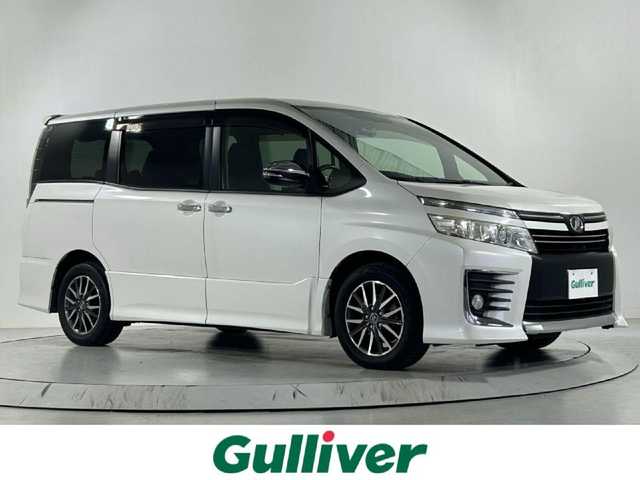 トヨタ ヴォクシー ZS 煌 佐賀県 2015(平27)年 7.3万km ホワイトパールクリスタルシャイン 社外7型ナビ/Bluetooth/CD/DVD/フルセグTV/フリップダウンモニター/バックカメラ/オートライト/横滑り防止/両側電動スライドドア/LEDヘッドライト/フォグランプ/ETC/ドアバイザー/純正16インチアルミホイール/スマートキー/プッシュスタート/リアサンシェード