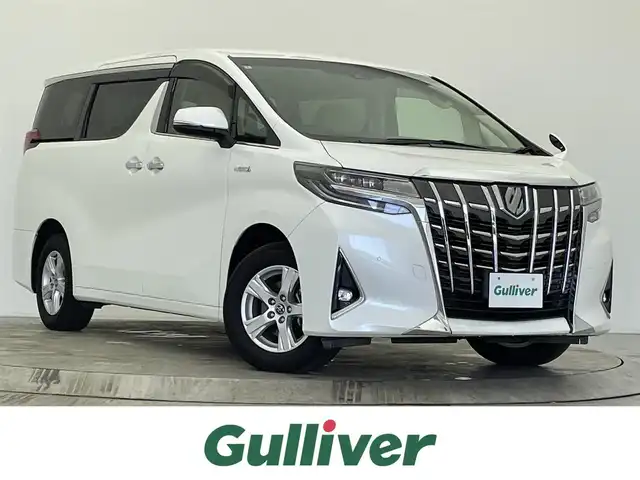 トヨタ アルファードハイブリット X 宮城県 2018(平30)年 4.5万km ホワイトパールクリスタルシャイン アルパイン９型ナビ　/フリップダウンモニター　/デジタルインナーミラー　/ＨＤＭＩ入力端子　/両側パワースライドドア　/アダプティブクルーズコントロール　/クリアランスソナー　/プリクラッシュセーフティシステム/レーントレーシングアシスト/オートマチックハイビーム/ETC /バックモニター　/後席オートAC/電子制御パーキングブレーキ/オートホールド/LEDヘッドランプ/フォグランプ/純正16インチAW/2列目キャプテンシート/オットマン/ナビリモコン/後席モニターリモコン付属/禁煙車