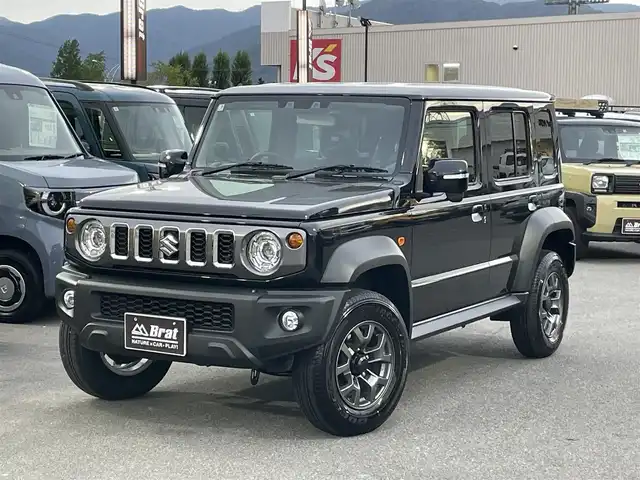 スズキ ジムニー ノマド FC 長野県 2025(令7)年 0.1千km 黒 切替４WDオートマ/ワンオーナー/前席シートヒーター/アイドリングストップ/オートマチックハイビーム/ダウンヒルアシストコントロール/横滑り防止/衝突被害軽減システム/ヘッドライトウォッシャー/クリアランスソナー/クルーズコントロール/純正アルミホイール/取扱説明書/保証書/スペアキー/プッシュスタート/スマートキー