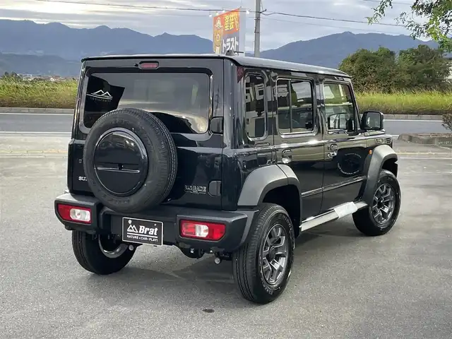 スズキ ジムニー ノマド FC 長野県 2025(令7)年 0.1千km 黒 切替４WDオートマ/ワンオーナー/前席シートヒーター/アイドリングストップ/オートマチックハイビーム/ダウンヒルアシストコントロール/横滑り防止/衝突被害軽減システム/ヘッドライトウォッシャー/クリアランスソナー/クルーズコントロール/純正アルミホイール/取扱説明書/保証書/スペアキー/プッシュスタート/スマートキー