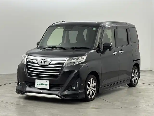 トヨタ ルーミー カスタムG－T 福岡県 2018(平30)年 5.6万km ブラックマイカメタリック モデリスタエアロ　/純正ナビ／フルセグＴＶ／ＢＴ　/両側パワースライドドア　/ＥＴＣ　/バックカメラ/クルーズコントロール　/衝突被害軽減システム　/レーンキープ　/コーナーセンサー　/横滑り防止　/オートマチックハイビーム　/ＬＥＤ