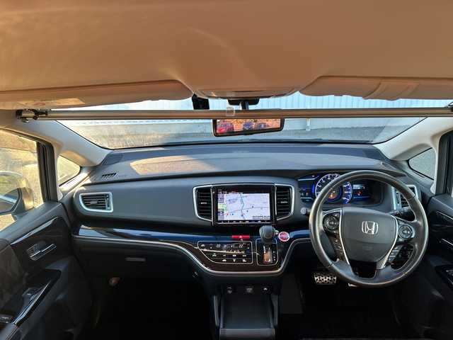 ホンダ オデッセイ ハイブリッド アブソルート・EXホンダセンジング 愛媛県 2018(平30)年 5.8万km プレミアムヴィーナスブラックP 全方位カメラ/純正ナビ/ブラインドスポットモニター/両側パワースライドドア/ビルトインETC2.0/衝突軽減システム/パワーシート/ハーフレザー/オートLED/シートヒーター/ドライブレコーダー前後/コーナーセンサー前後/クルーズコントロール追従あり/レーンキープアシスト/フォグランプ/純正フロアマット/３列シート/オットマン/スマートキー/スペアキー1本