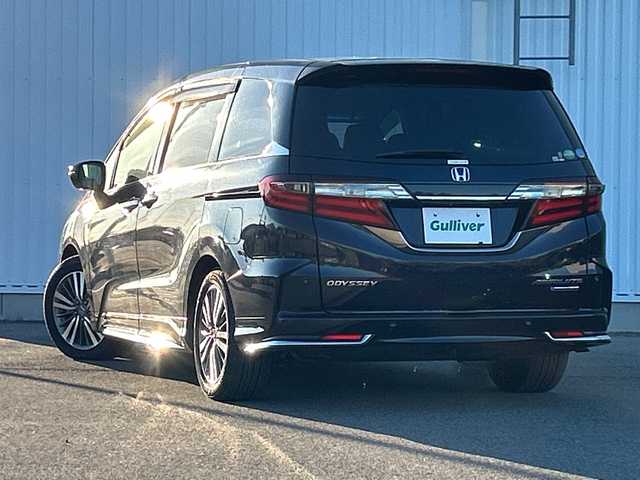ホンダ オデッセイ ハイブリッド アブソルート・EXホンダセンジング 愛媛県 2018(平30)年 5.8万km プレミアムヴィーナスブラックP 全方位カメラ/純正ナビ/ブラインドスポットモニター/両側パワースライドドア/ビルトインETC2.0/衝突軽減システム/パワーシート/ハーフレザー/オートLED/シートヒーター/ドライブレコーダー前後/コーナーセンサー前後/クルーズコントロール追従あり/レーンキープアシスト/フォグランプ/純正フロアマット/３列シート/オットマン/スマートキー/スペアキー1本