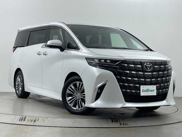 トヨタ アルファードハイブリット Z 埼玉県 2024(令6)年 2.8万km プラチナホワイトパールマイカ 純正ナビ/全方位カメラ/電動リアゲート/ビルトインETC2.0/レーダークルーズコントロール/両側パワースライドドア/ワイヤレス充電器/ハンドルヒーター/BSM/AC100V/ドライブレコーダー/全席パワーシート/オットマン/レーンキープアシスト　/安心降車アシスト/ロードサインアシスト/ロールサンシェード/LEDヘッドライト/オートマチックハイビーム/フォグランプ/純正フロアマット/純正アルミホイール