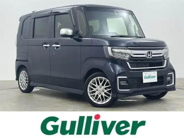 ホンダ Ｎ ＢＯＸ カスタム L ターボ 岡山県 2022(令4)年 2.2万km ミッドナイトブルービームM ホンダセンシング/Gathersナビゲーション/【フルセグ/Bluetooth/DVD】/純正17inアルミホイール+サマータイヤ：装着/レーダークルーズコントロール/ビルトインETC/シートバックテーブル/リアサンシェイド/LEDヘッドライト（AUTO機能付き）/シートヒーター/横滑り防止機能/衝突軽減システム/車線逸脱防止システム/スマートキー/プッシュスタート/コーナーセンサー/純正フロアマット