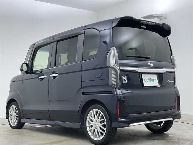 ホンダ Ｎ ＢＯＸ カスタム L ターボ 岡山県 2022(令4)年 2.2万km ミッドナイトブルービームM ホンダセンシング/Gathersナビゲーション/【フルセグ/Bluetooth/DVD】/純正17inアルミホイール+サマータイヤ：装着/レーダークルーズコントロール/ビルトインETC/シートバックテーブル/リアサンシェイド/LEDヘッドライト（AUTO機能付き）/シートヒーター/横滑り防止機能/衝突軽減システム/車線逸脱防止システム/スマートキー/プッシュスタート/コーナーセンサー/純正フロアマット