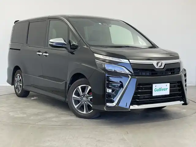 トヨタ ヴォクシー ZS 煌Ⅱ 新潟県 2020(令2)年 6.3万km イナズマスパーキングブラックガラスフレーク 純正メモリナビ【NSZT-Y68T】/　フルセグTV/Bluetooth/CD/DVD/衝突被害軽減ブレーキ/レーンキープアシスト/両側パワースライドドア/前後コーナーセンサー/前後ドライブレコーダー【DC-DR651】/クルーズコントロール/バックモニター/ビルトインETC/アイドリングストップ/オートマチックハイビーム/LEDヘッドライト/横滑り防止装置/レザーステアリング/ステアリングスイッチ