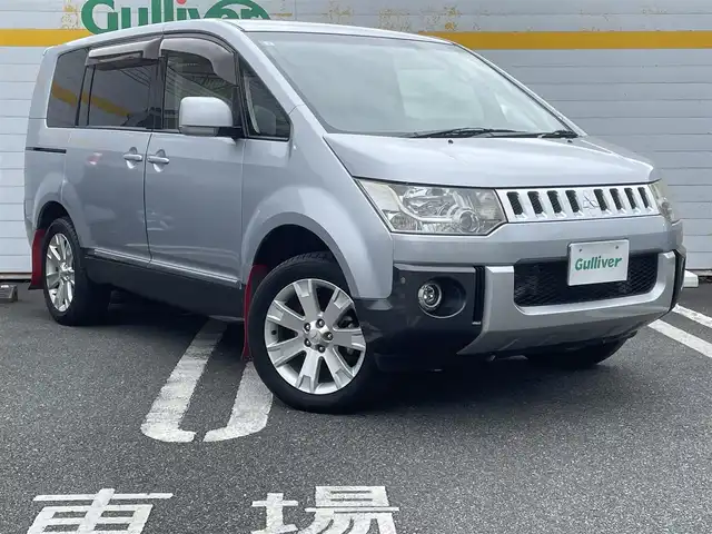 三菱 デリカＤ：５ D－Power package 埼玉県 2013(平25)年 10.3万km クールシルバーM/アイガーグレーM ディーゼル/純正ディーラーナビ/社外フリップダウン/両側パワースライド/クルコン/純正アルミ/フロアマット/バックカメラ/社外シフトノブ/JAOSマッドガード/フォグライト/シートカバー付き/スマートキー×2/スタッドレスタイヤ、アルミ付き