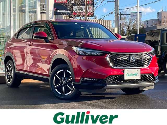 ホンダ ヴェゼル ハイブリッド e:HEV X 道央・札幌 2022(令4)年 2.3万km プレミアムクリスタルレッドM ・４WD/・衝突軽減ブレーキ/・寒冷地仕様/・純正ディスプレイオーディオ/　BT＆USB＆TV/・バックカメラ/・コーナーセンサー/・レーンキープアシスト/・レーダークルーズコントロール/・置くだけ充電/・シートヒーター/・ミラーヒーター/・オートエアコン/・オートライト/・電動格納ミラー/・ダウンヒルアシスト/・プッシュスタート/・スマートキー/・ワイパーデアイサー/・パドルシフト/・ビルトインETC/・純正フロアマット/・ドアバイザー/・ウィンカーミラー/・フォグライト/・LEDヘッドライト