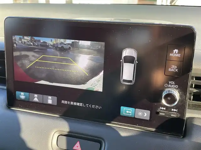 ホンダ ヴェゼル ハイブリッド e:HEV X 道央・札幌 2022(令4)年 2.3万km プレミアムクリスタルレッドM ・４WD/・衝突軽減ブレーキ/・寒冷地仕様/・純正ディスプレイオーディオ/　BT＆USB＆TV/・バックカメラ/・コーナーセンサー/・レーンキープアシスト/・レーダークルーズコントロール/・置くだけ充電/・シートヒーター/・ミラーヒーター/・オートエアコン/・オートライト/・電動格納ミラー/・ダウンヒルアシスト/・プッシュスタート/・スマートキー/・ワイパーデアイサー/・パドルシフト/・ビルトインETC/・純正フロアマット/・ドアバイザー/・ウィンカーミラー/・フォグライト/・LEDヘッドライト