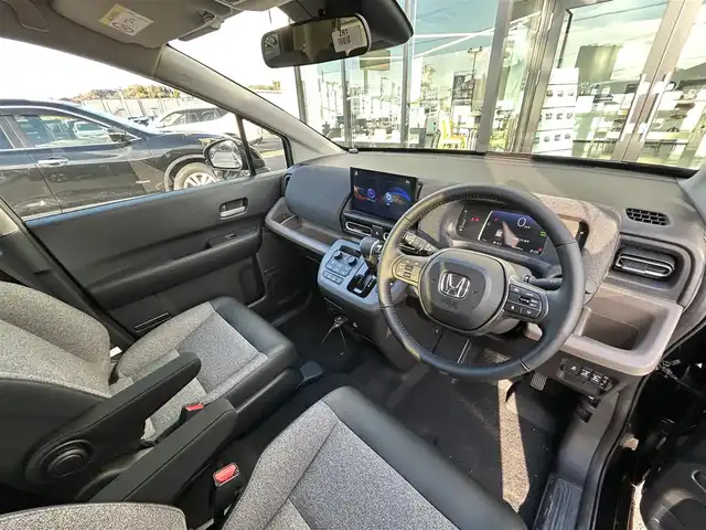 ホンダ フリード ハイブリット e:HEV AIR EX 愛媛県 2025(令7)年 0.1万km クリスタルブラックパール ホンダセンシング/クリアランスソナー/純正15インチアルミホイール/両側パワースライドドア/アダプティブクルーズコントロール/ブラインドスポットモニター/ハーフレザーシート/シートヒーター/前後コーナーセンサー/オートマチックハイビーム/LEDヘッドライト/スマートキー