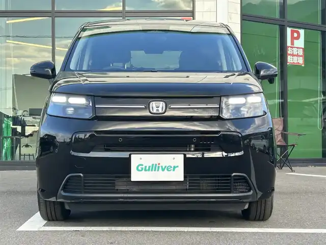 ホンダ フリード ハイブリット e:HEV AIR EX 愛媛県 2025(令7)年 0.1万km クリスタルブラックパール ホンダセンシング/クリアランスソナー/純正15インチアルミホイール/両側パワースライドドア/アダプティブクルーズコントロール/ブラインドスポットモニター/ハーフレザーシート/シートヒーター/前後コーナーセンサー/オートマチックハイビーム/LEDヘッドライト/スマートキー