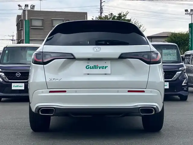ホンダ ＺＲ－Ｖ Z 静岡県 2023(令5)年 2.7万km プラチナホワイトパール Honda SENSING/ブラインドスポットインフォメーション/後退出庫サポート/アダプティブドライビングビーム/マルチビューカメラシステム/Honda CONNECTディスプレー/ETC2.0車載器/ワイヤレス充電器/本革シート/運転席8ウェイ助手席4ウェイパワーシート(ドライビングポジションシステム付)/運転席＆助手席シートヒーター/BOSEプレミアムサウンドシステム(12スピーカー)/ハンズフリーアクセスパワーテールゲート(予約クローズ機能付)/純正18インチアルミホイール(切削＋ベルリナブラック)/エンジンスタートボタン/パワーステアリング/パワーウィンドウ/スマートキー/オートエアコン/クルーズコントロール/USB入力端子/純正フロアマット/ABS/横滑り防止装置/コーナーセンサー前後/レーンキープアシスト/オートライト/オートマチックハイビーム/ダウンヒルアシストコントロール/LEDヘッドライト/W＋サイドエアバック/衝突軽減システム/カーテンエアバック/衝突軽減システム/ステアリングヒーター