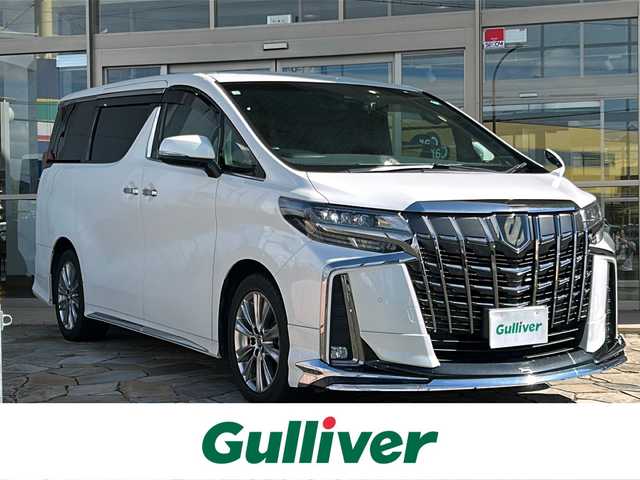 トヨタ アルファード S タイプゴールドⅡ 静岡県 2021(令3)年 3.9万km ホワイトパールクリスタルシャイン 【安全装備】/トヨタセーフティセンス/プリクラッシュセーフティ/（ミリ波レーダー・単眼カメラ・昼自転車運転者＆夜間歩行者検知機能付）/（対車両：自車車速域約10km/hから最高速度：最大約40km/h減速可）/（対歩行者：自車車速域約10km/hから80km/h間：最大約30km/h減速可）/レーダークルーズコントロール（全車速追従機能付/ブレーキ制御付）/レーントレーシングアシスト（LTA）（作動車速：50km/h以上時）/（ステアリング操作支援）/ロードサインアシスト（RSA）（道路標識認識支援）/オートマチックハイビーム/【主要装備】/アルパイン１１型ナビ　/アルパイン１２．８型後席フリップダウンモニター　/クリアランスソナー　/モデリスタエアロ　/両側パワースライドドア　/ハーフレザーシート　/前後ドライブレコーダー