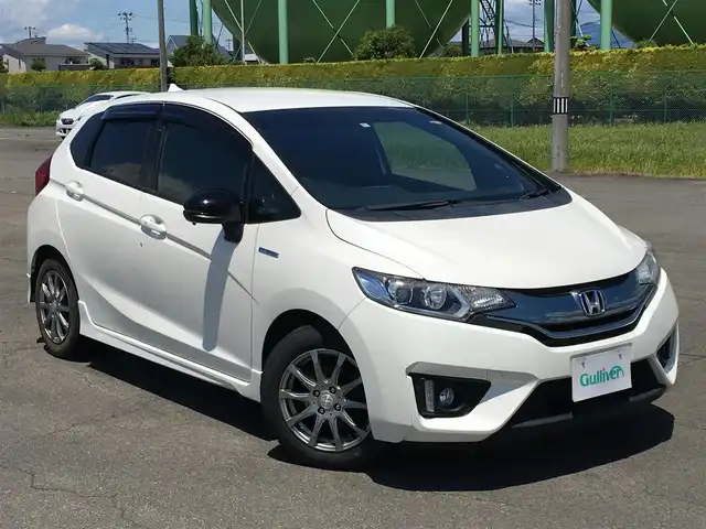 ホンダ フィットハイブリッド ハイブリッド Sパッケージ 社外ナビ パドルシフト 横滑り防止 14年式 平成26年式 プレミアムホワイトパール Id 中古車検索のガリバー