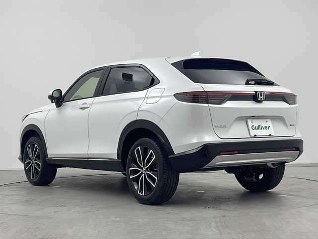 ホンダ ヴェゼル ハイブリッド e:HEV Z 三重県 2025(令7)年 0.1万km未満 プラチナホワイトパール 登録済み未使用車/純正９インチディスプレイオーディオ/　フルセグTV/カープレイ/Bluetooth/ETC2.0車載器/ワイヤレス充電器/パワーバックドア/レーダークルーズコントロール/ハンドルヒーター/バックカメラ/電子パーキング/オートホールド/電格ミラー/プッシュスタート/スマートキー/スペアキー