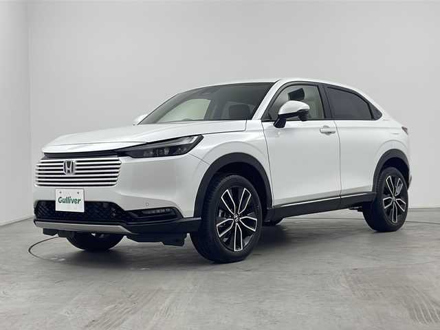 ホンダ ヴェゼル ハイブリッド e:HEV Z 三重県 2025(令7)年 0.1万km未満 プラチナホワイトパール 登録済み未使用車/純正９インチディスプレイオーディオ/　フルセグTV/カープレイ/Bluetooth/ETC2.0車載器/ワイヤレス充電器/パワーバックドア/レーダークルーズコントロール/ハンドルヒーター/バックカメラ/電子パーキング/オートホールド/電格ミラー/プッシュスタート/スマートキー/スペアキー
