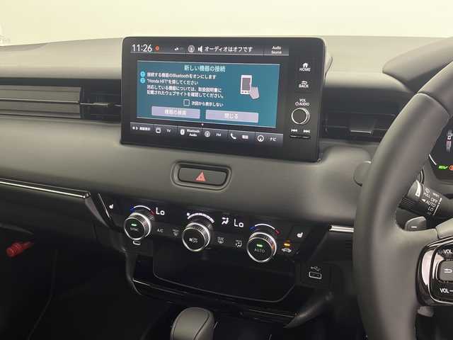 ホンダ ヴェゼル ハイブリッド e:HEV Z 三重県 2025(令7)年 0.1万km未満 プラチナホワイトパール 登録済み未使用車/純正９インチディスプレイオーディオ/　フルセグTV/カープレイ/Bluetooth/ETC2.0車載器/ワイヤレス充電器/パワーバックドア/レーダークルーズコントロール/ハンドルヒーター/バックカメラ/電子パーキング/オートホールド/電格ミラー/プッシュスタート/スマートキー/スペアキー