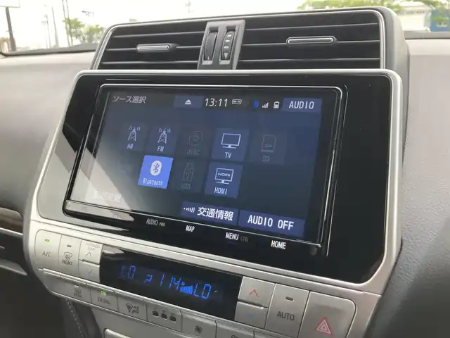 トヨタ ランドクルーザー プラド TX Lパッケージ 鳥取県 2018(平30)年 6.7万km アティチュードブラックマイカ ワンオーナー/４WD・ディーゼルターボ/７人乗り・３列シート/純正9型ナビ/フルセグ/CD/DVD/BT/USB/HDMI/バックカメラ/プリクラッシュセーフティ/レーンキープアシスト/ビルトインETC/黒レザーシート/前席パワーシート/前席シートヒーター/電動格納サードシート/レーダークルーズコントロール/LEDヘットライト/フォグライト/純正19インチアルミホイール/プッシュエンジンスタート/スマートキー×２