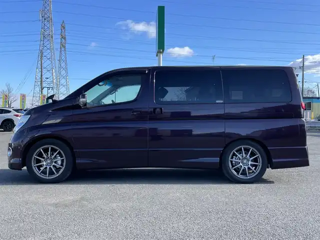 日産 エルグランド 250ハイウェイスター ブラックレザ-ナビ 道央・札幌 2008(平20)年 8.6万km ディープカシス ４WD/社外メモリーナビ/AM/FM/CD/DVD/BT/AUX/ワンセグ/社外フリップダウンモニター/コーナーセンサー/バックカメラ/フロントカメラ/両側パワースライドドア/D席パワーシート/前席シートヒーター/オットマン/レザーシート/革巻きウッドコンビステアリング/ステアリングリモコン/MTモード付AT/スマートキー/オートライト/フォグランプ/キセノンヘッドライト/電動格納ミラー/ウィンカーミラー/純正フロアマット/ドアバイザー/スペアキー