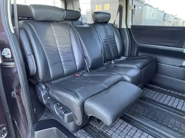 日産 エルグランド 250ハイウェイスター ブラックレザ-ナビ 道央・札幌 2008(平20)年 8.6万km ディープカシス ４WD/社外メモリーナビ/AM/FM/CD/DVD/BT/AUX/ワンセグ/社外フリップダウンモニター/コーナーセンサー/バックカメラ/フロントカメラ/両側パワースライドドア/D席パワーシート/前席シートヒーター/オットマン/レザーシート/革巻きウッドコンビステアリング/ステアリングリモコン/MTモード付AT/スマートキー/オートライト/フォグランプ/キセノンヘッドライト/電動格納ミラー/ウィンカーミラー/純正フロアマット/ドアバイザー/スペアキー