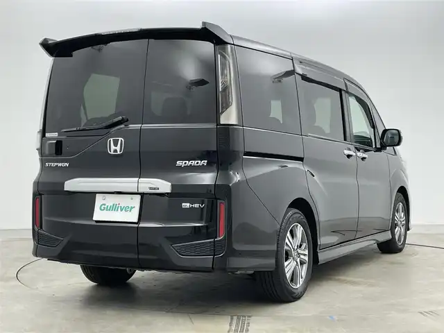 ホンダ ステップワゴン スパーダ eHEV G ホンダS 岡山県 2021(令3)年 5万km プレミアムスパークルブラックパール 純正１０インチナビ　(VXU-227SWi)/【CD/DVD/USB/HDMI/フルセグ】/バックカメラ　/両側電動スライド　/レーダークルーズコントロール　/ビルトインＥＴＣ２．０　/ＬＥＤヘッドライト　/ドライブレコーダー　前後/オートハイビーム　/アイドリングストップ　/フォグランプ/禁煙車/オートブレーキホールド/純正アルミ/純正フロアマット