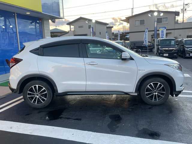 ホンダ ヴェゼル ハイブリッド X Lパッケージ 長野県 2014(平26)年 12.1万km ホワイトオーキッドパール 【(株)IDOMが運営する【じしゃロン長野店】の自社ローン対象車両になります。こちらは現金ご利用時の価格です。自社ローンご希望の方は別途その旨お申付け下さい。/社外ナビ/バックカメラ/ステアリングスイッチ/クルーズコントロール/シートヒーター/純正フロアマット/純正アルミホイール