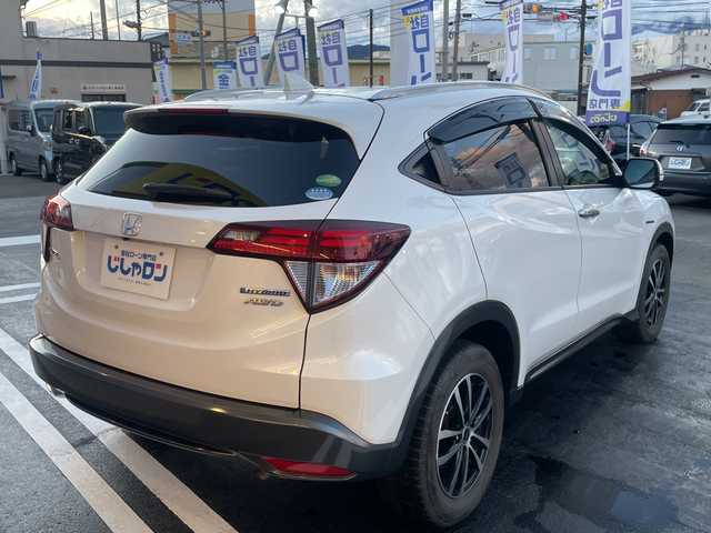 ホンダ ヴェゼル ハイブリッド X Lパッケージ 長野県 2014(平26)年 12.1万km ホワイトオーキッドパール 【(株)IDOMが運営する【じしゃロン長野店】の自社ローン対象車両になります。こちらは現金ご利用時の価格です。自社ローンご希望の方は別途その旨お申付け下さい。/社外ナビ/バックカメラ/ステアリングスイッチ/クルーズコントロール/シートヒーター/純正フロアマット/純正アルミホイール